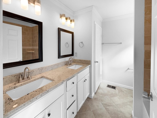 bathroom featuring tile patterned flooring, vanity, and ornamental molding