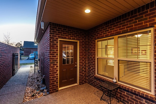 view of exterior entry at dusk