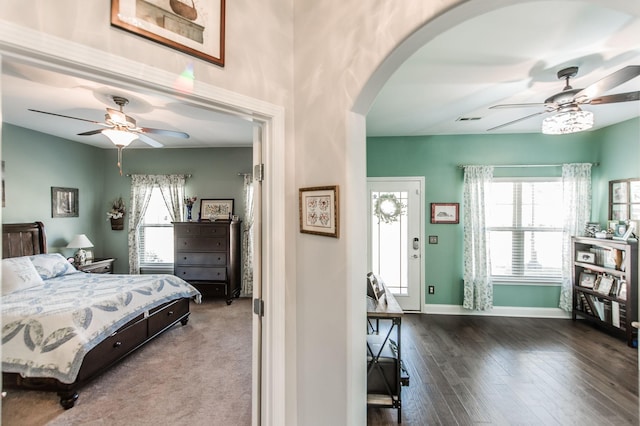 bedroom with hardwood / wood-style flooring and ceiling fan