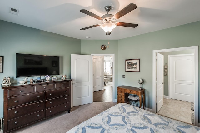 carpeted bedroom featuring ceiling fan