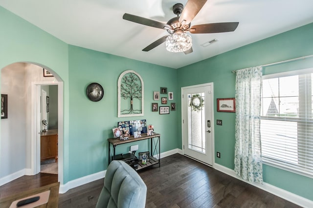 foyer with dark wood-type flooring and ceiling fan