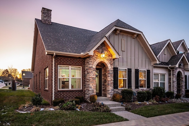 view of front of home with a lawn