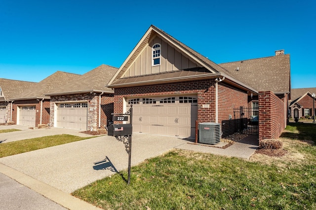 view of front of property with a front yard and central air condition unit