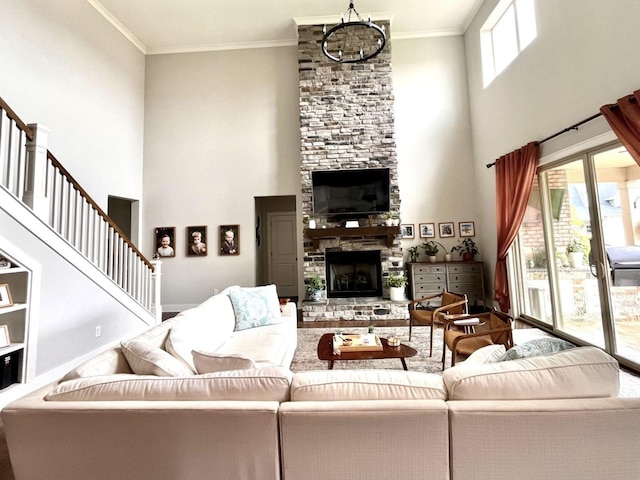 living room featuring ornamental molding, a stone fireplace, and a high ceiling