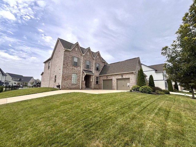 view of front of home with a garage and a front lawn