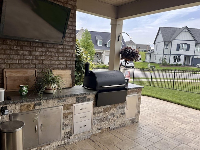 view of patio with area for grilling and grilling area