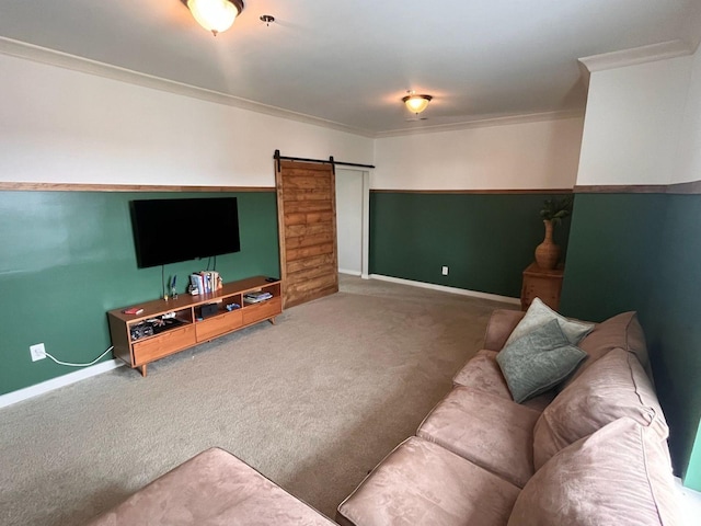 living room featuring crown molding, a barn door, and carpet flooring