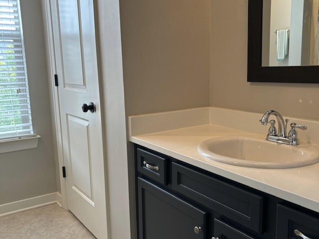 bathroom featuring tile patterned flooring and vanity