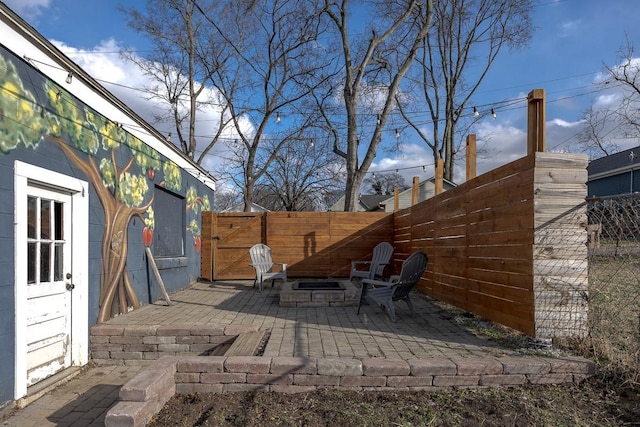 view of patio / terrace with an outdoor fire pit