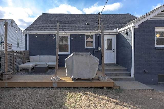 back of house with outdoor lounge area and a deck