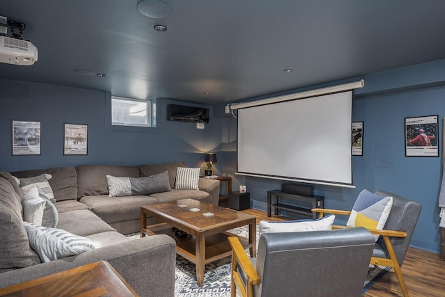 home theater room with hardwood / wood-style flooring