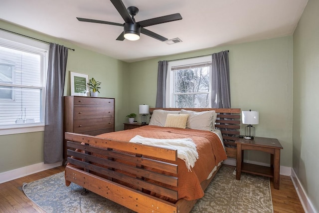 bedroom with hardwood / wood-style flooring and ceiling fan