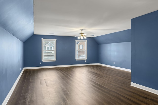 additional living space with dark wood-type flooring, ceiling fan, and vaulted ceiling