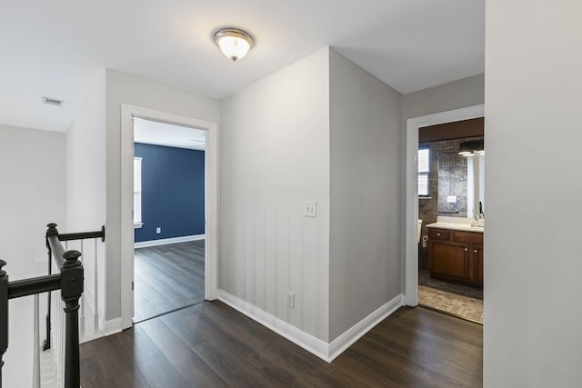 hallway featuring dark wood-type flooring