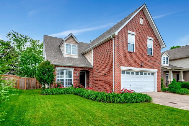 traditional-style home with fence, a shingled roof, an attached garage, a front lawn, and brick siding