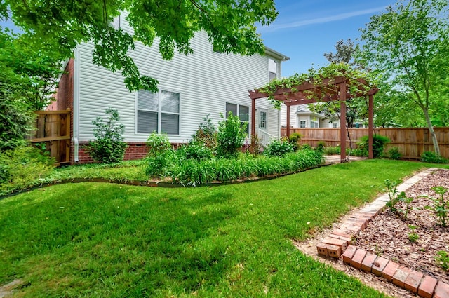 view of yard featuring fence and a pergola
