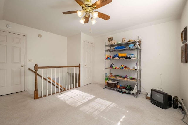 interior space with ceiling fan