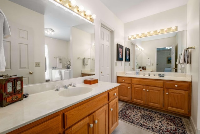 bathroom featuring tile patterned flooring and vanity