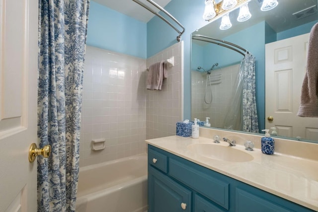 bathroom featuring vanity and shower / bath combo with shower curtain