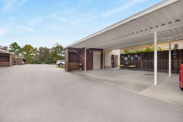 exterior space featuring a garage and a carport