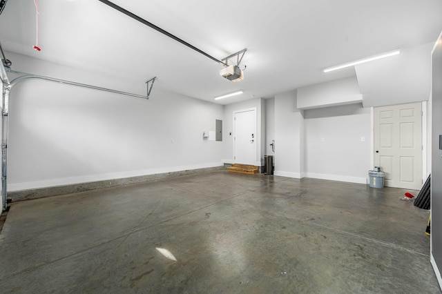 garage featuring a garage door opener and electric panel