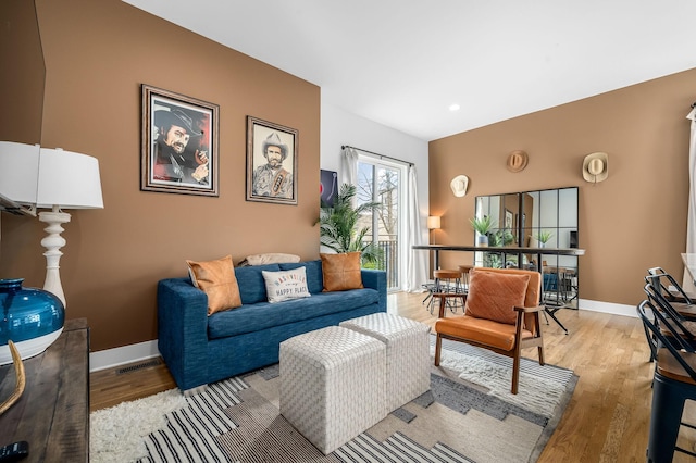 living room with light hardwood / wood-style flooring