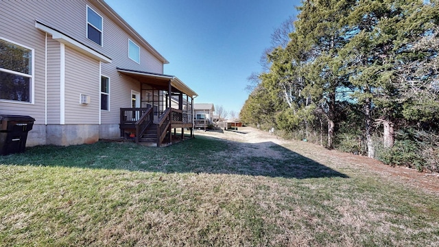 view of yard with a wooden deck