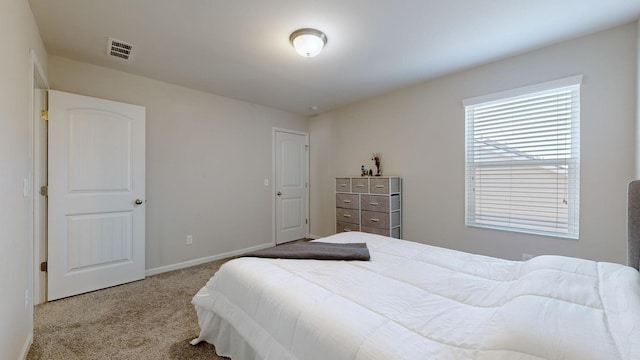 bedroom featuring light colored carpet