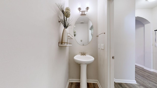 bathroom featuring hardwood / wood-style flooring