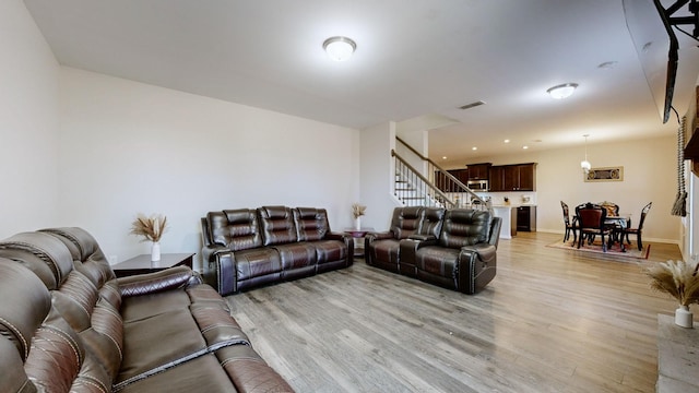 living room with light hardwood / wood-style floors