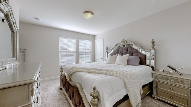 bedroom featuring light carpet