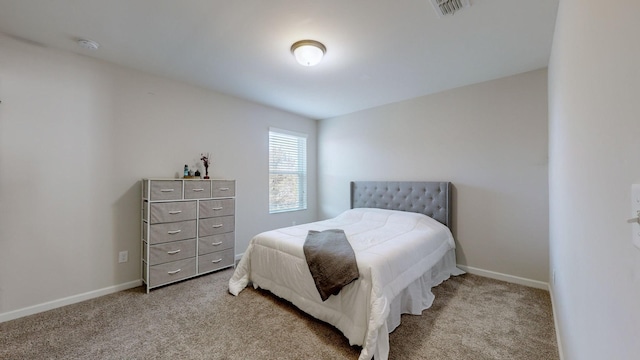 bedroom featuring light colored carpet