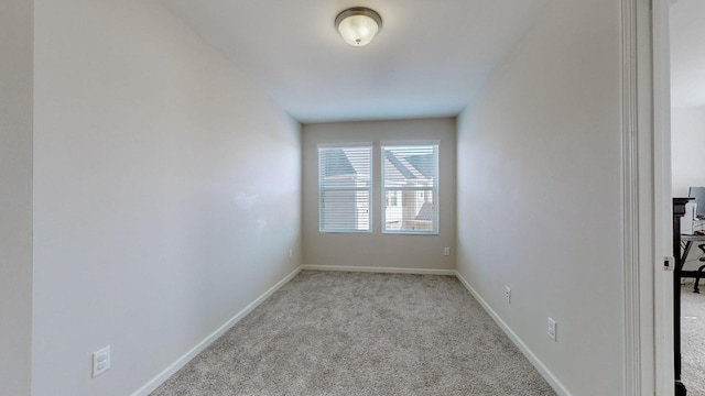 empty room with light colored carpet