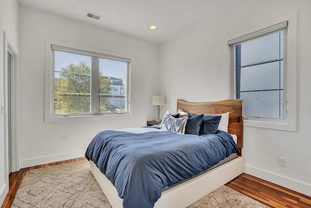 bedroom with wood-type flooring