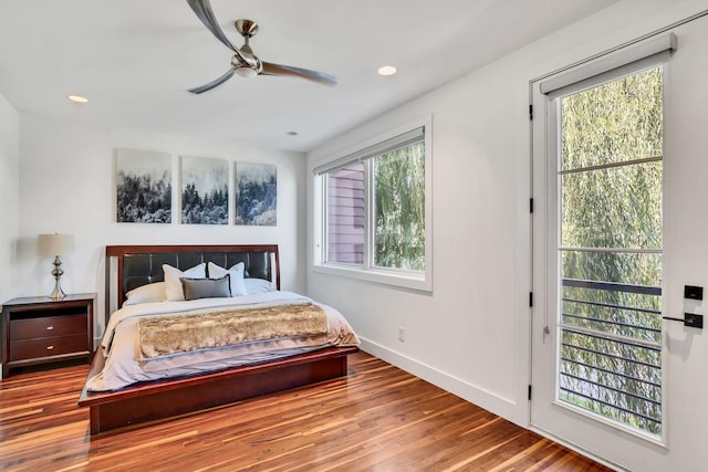 bedroom with ceiling fan and hardwood / wood-style floors