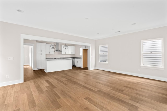 unfurnished living room with light hardwood / wood-style floors