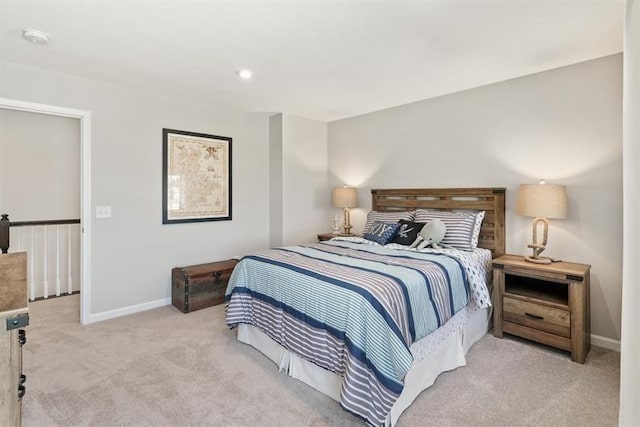 bedroom with light colored carpet