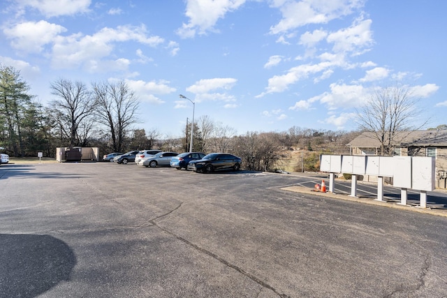 view of parking featuring mail boxes