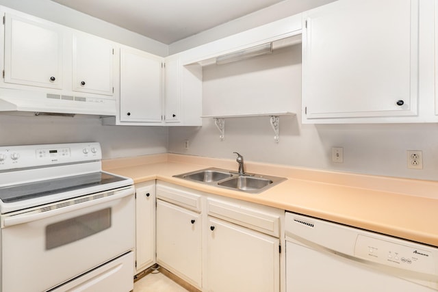 kitchen with sink, white appliances, and white cabinets