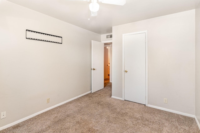 unfurnished bedroom with carpet and ceiling fan