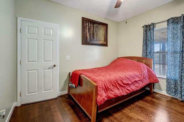 bedroom featuring ceiling fan and dark hardwood / wood-style floors