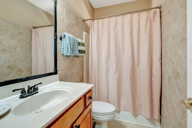 bathroom featuring vanity, tile patterned floors, toilet, and walk in shower