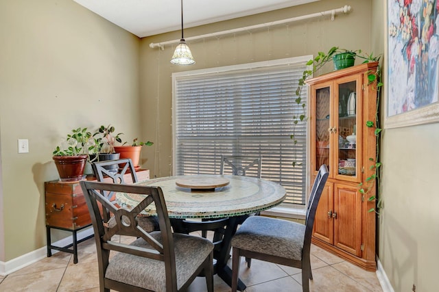 tiled dining room featuring a wealth of natural light