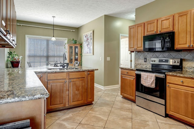 kitchen with sink, electric range, and light stone countertops