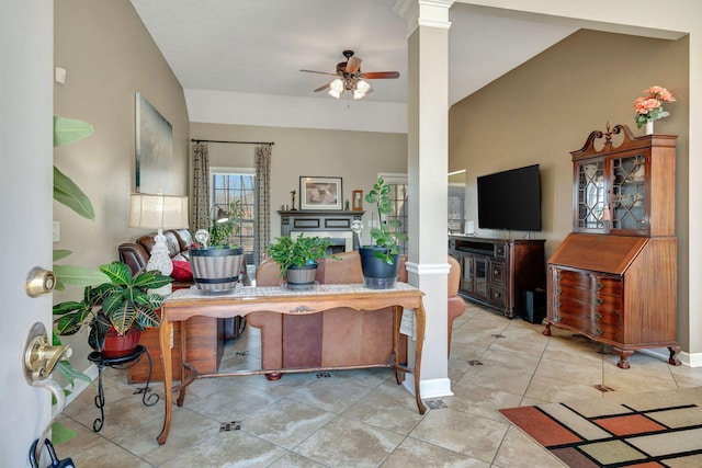 tiled office space featuring ornate columns and ceiling fan