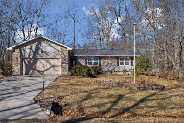 ranch-style home with a garage and a front yard