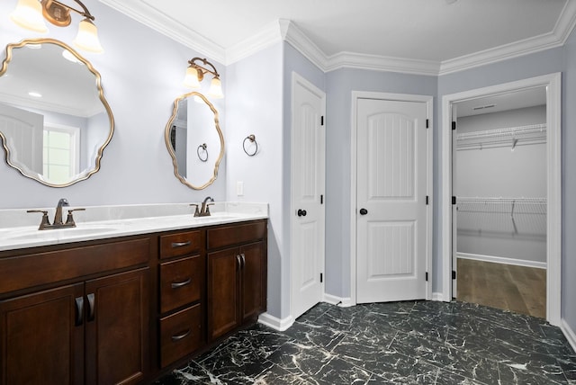 bathroom with ornamental molding and vanity