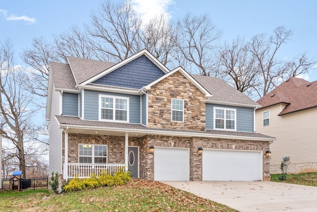 view of front facade with a garage and covered porch