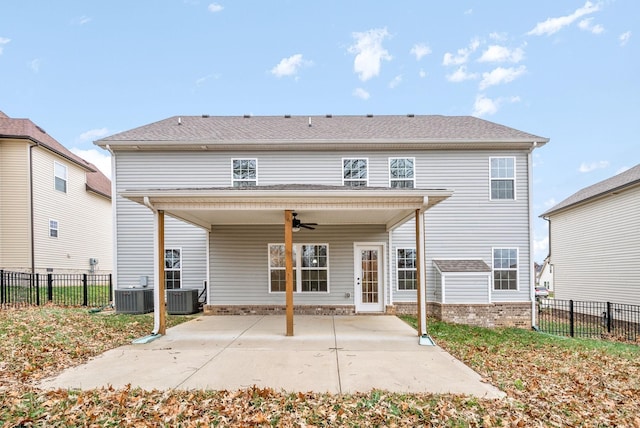 rear view of house featuring cooling unit, ceiling fan, and a patio area