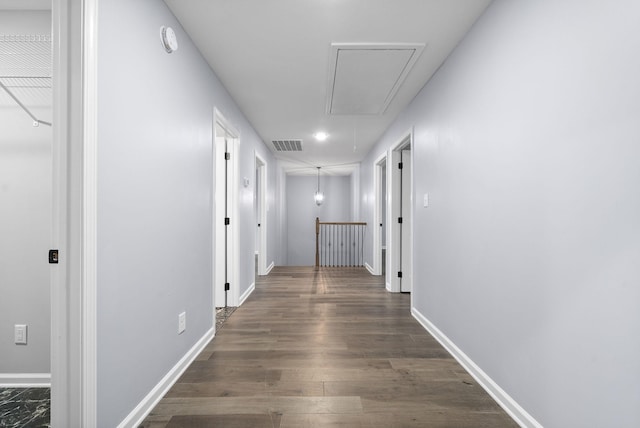 hallway with dark hardwood / wood-style flooring